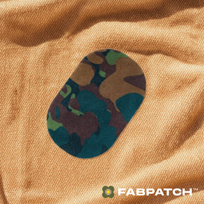 Camouflage patch on a brown fabric with Fabpatch logo.